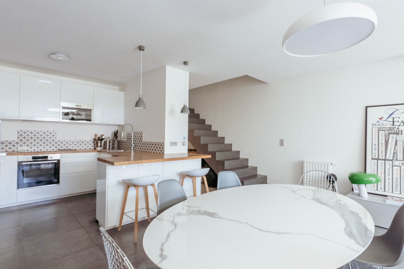 Kitchen open to the living room, island and table